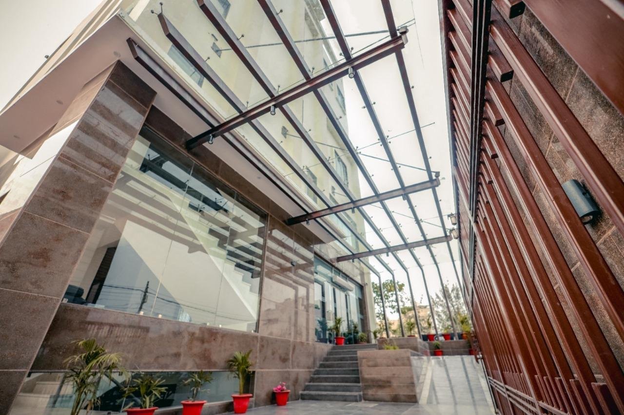 The Royal Legacy Resort Glass Entrance Canopy and Marble Stairs